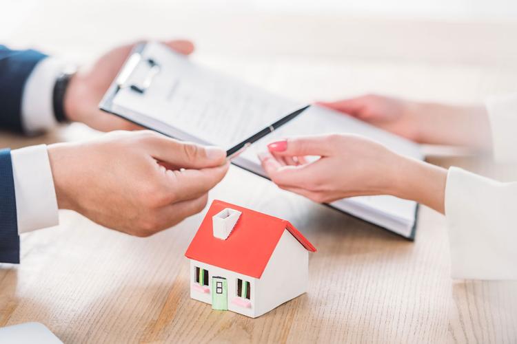 Partial View Realtor Giving Pen Clipboard Loan Agreement Client House